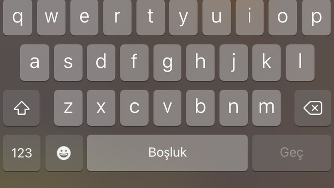 Asagidaki dunyaya benzer seyin yerine emoji tusunu nasil koyabilirim?