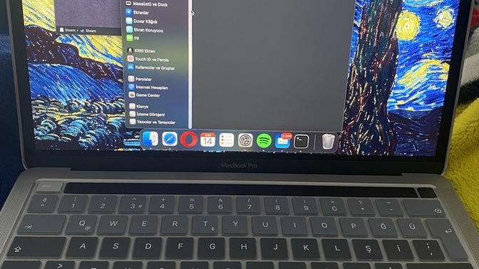 Macbook sistem tercihleri sekmesinin ilk görünüşü değişti ve çok karışık geliyor eski görünüşe nasıl çevirebilirim?