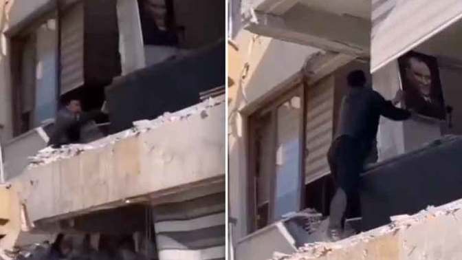 Deprem bölgesinde ağır hasarlı binaya girdi, Atatürk portresini aldı. Siz olsaydınız ne yapardınız?