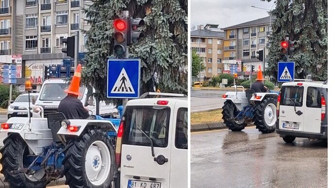 Bolu’da yağmurdan korunmak isteyen traktör sürücüsü, başına trafik dubası giydi! Sizce ceza almış mıdır?